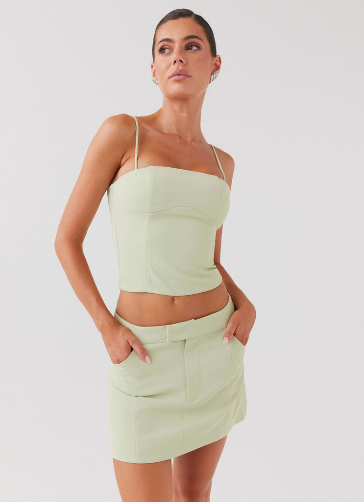 Womens Eliana Suit Mini Skirt in the colour Green Zest in front of a light grey background