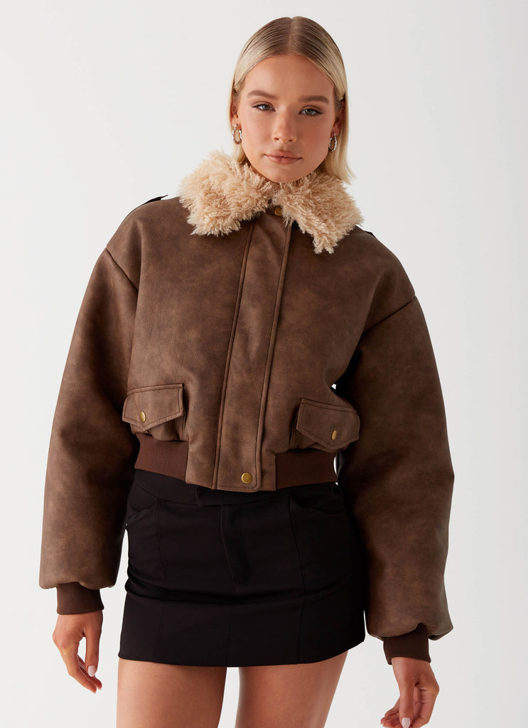 Womens Aston Shearling Bomber Jacket in the colour Brown in front of a light grey background