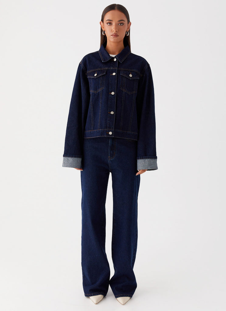Womens Back Again Oversized Denim Jacket in the colour Blue in front of a light grey background