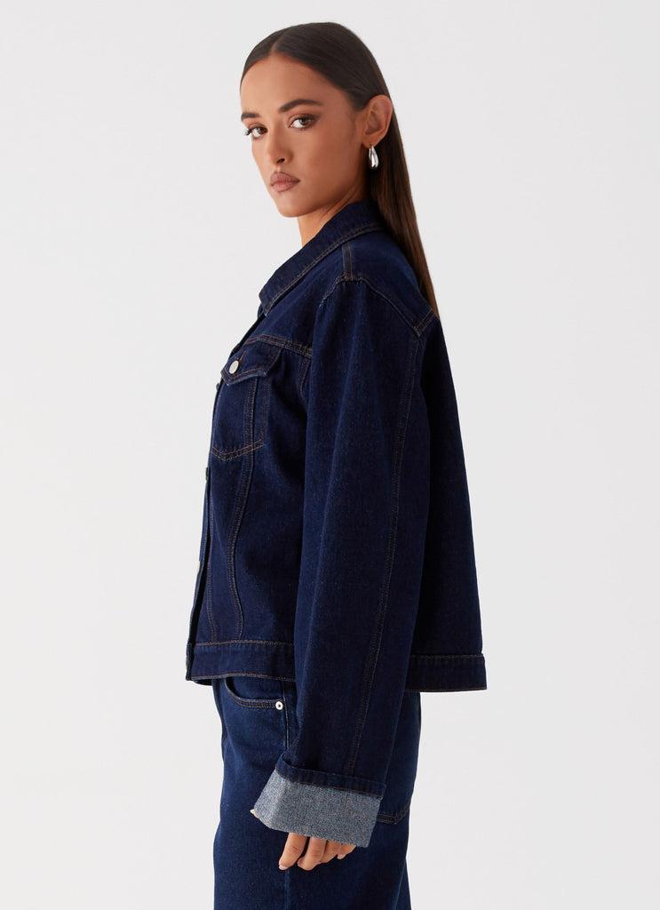 Womens Back Again Oversized Denim Jacket in the colour Blue in front of a light grey background