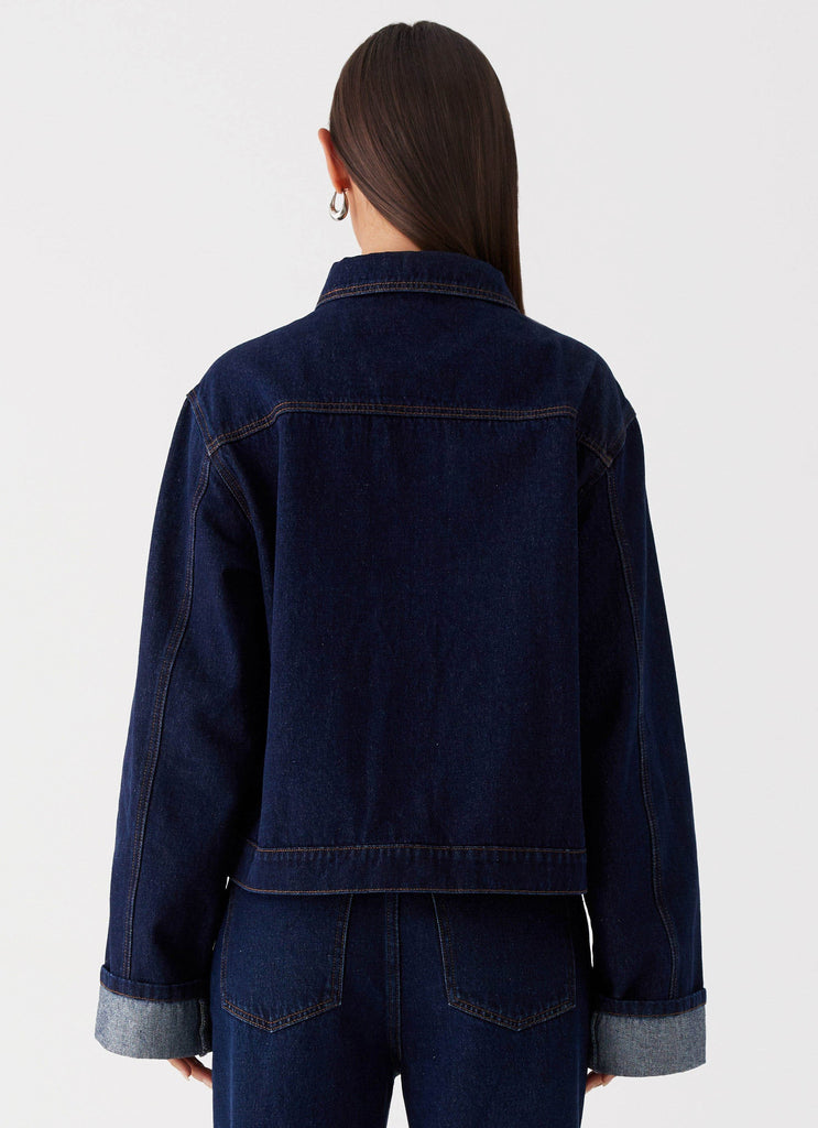 Womens Back Again Oversized Denim Jacket in the colour Blue in front of a light grey background