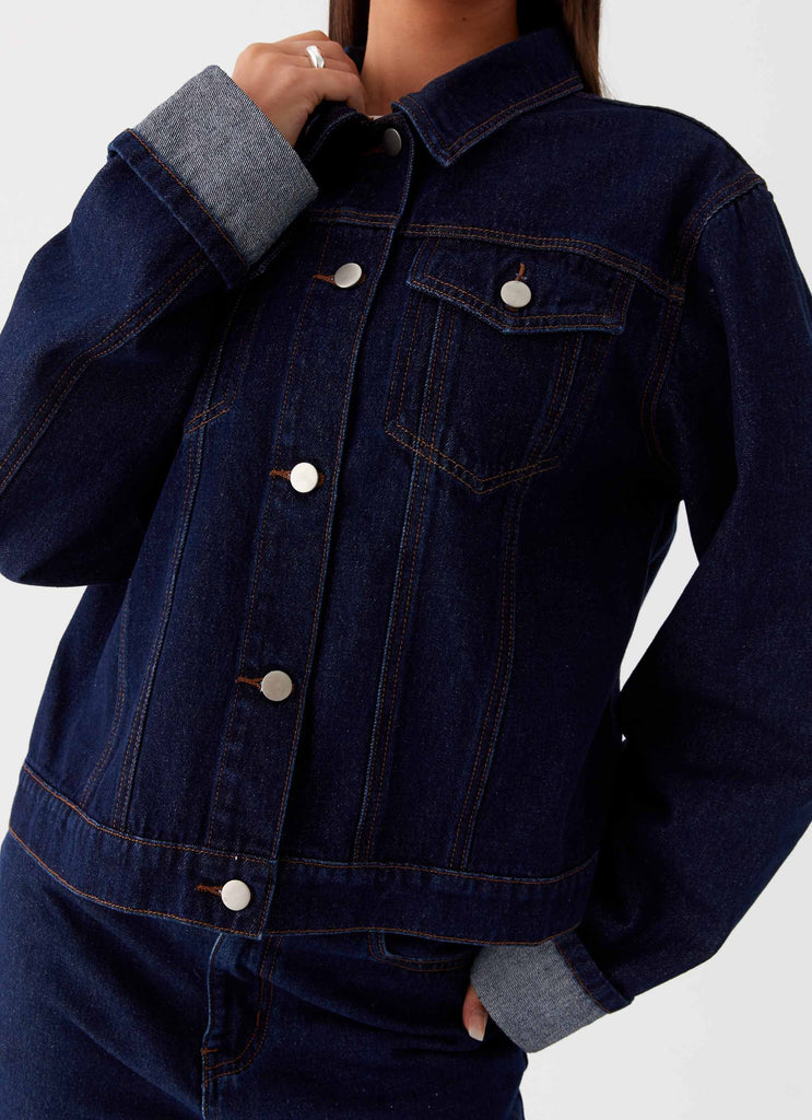 Womens Back Again Oversized Denim Jacket in the colour Blue in front of a light grey background