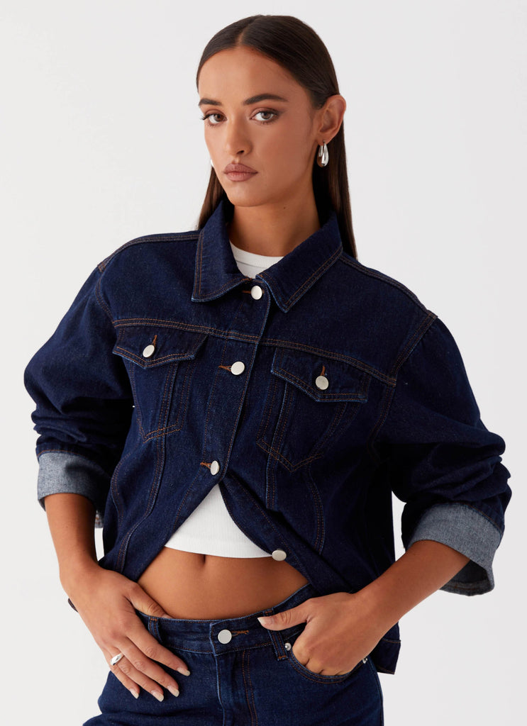 Womens Back Again Oversized Denim Jacket in the colour Blue in front of a light grey background