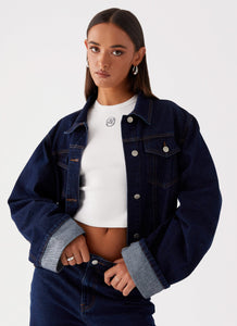 Womens Back Again Oversized Denim Jacket in the colour Blue in front of a light grey background