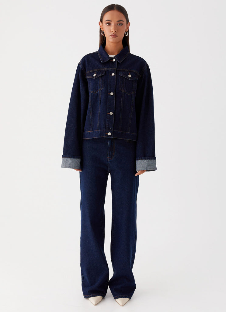Womens Back Again Oversized Denim Jacket in the colour Blue in front of a light grey background