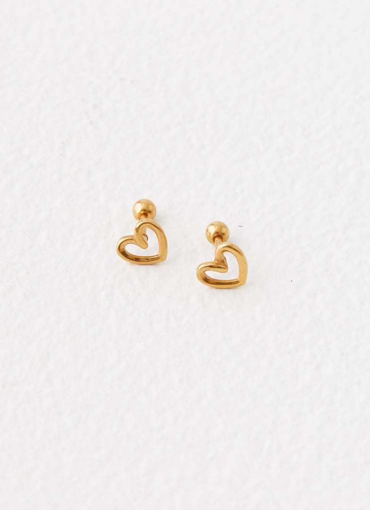 Womens Issie Heart Earrings in the colour Gold in front of a light grey background