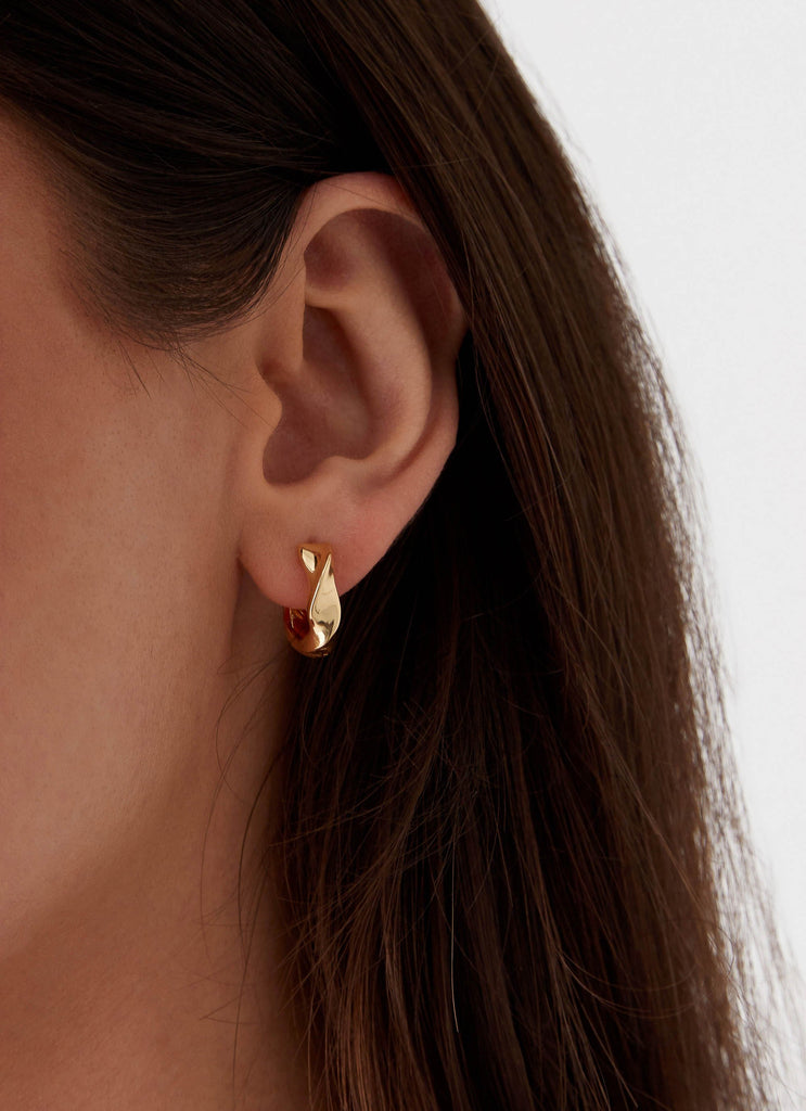 Womens Jacquie Hoop Earrings in the colour Gold in front of a light grey background