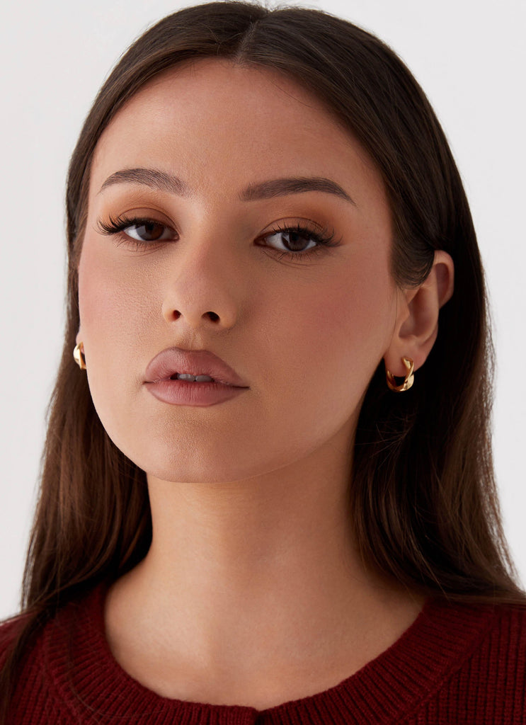 Womens Jacquie Hoop Earrings in the colour Gold in front of a light grey background