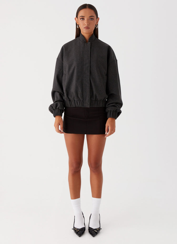 Womens Lorelei Oversized Bomber Jacket in the colour Charcoal in front of a light grey background