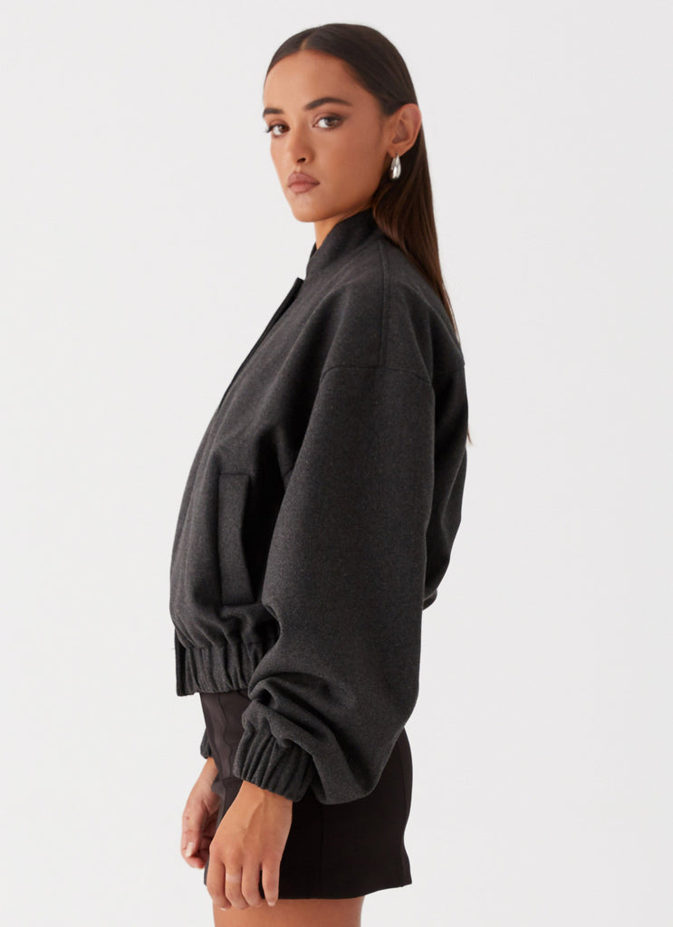 Womens Lorelei Oversized Bomber Jacket in the colour Charcoal in front of a light grey background