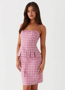 Womens Mamita Midi Skirt in the colour Pink Check in front of a light grey background