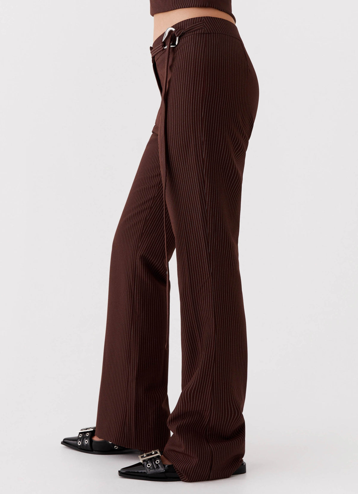 Womens Orla Fitted Flare Pants in the colour Chocolate in front of a light grey background