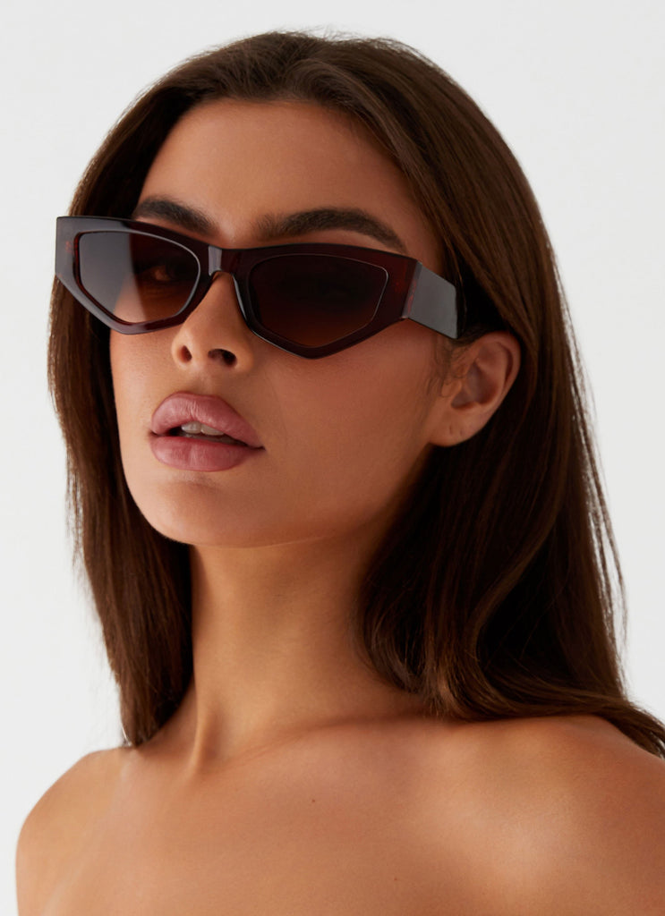 Womens Kyia Sunglasses in the colour Brown in front of a light grey background