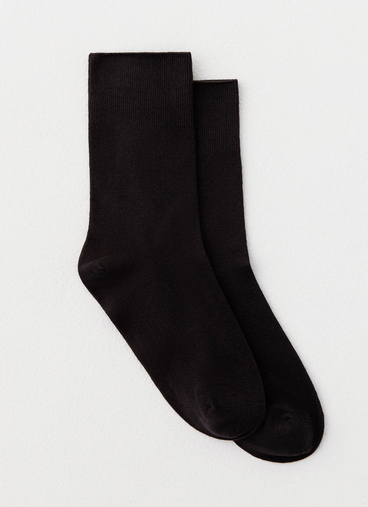 Womens Ludde Ankle Socks in the colour Black in front of a light grey background