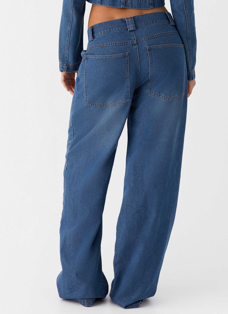 Womens Ride Elegant Baggy Jeans in the colour Vintage Blue Wash in front of a light grey background