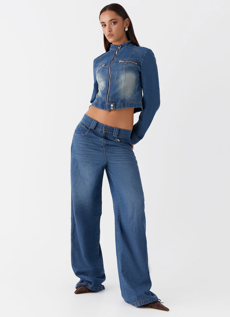 Womens Ride Elegant Baggy Jeans in the colour Vintage Blue Wash in front of a light grey background