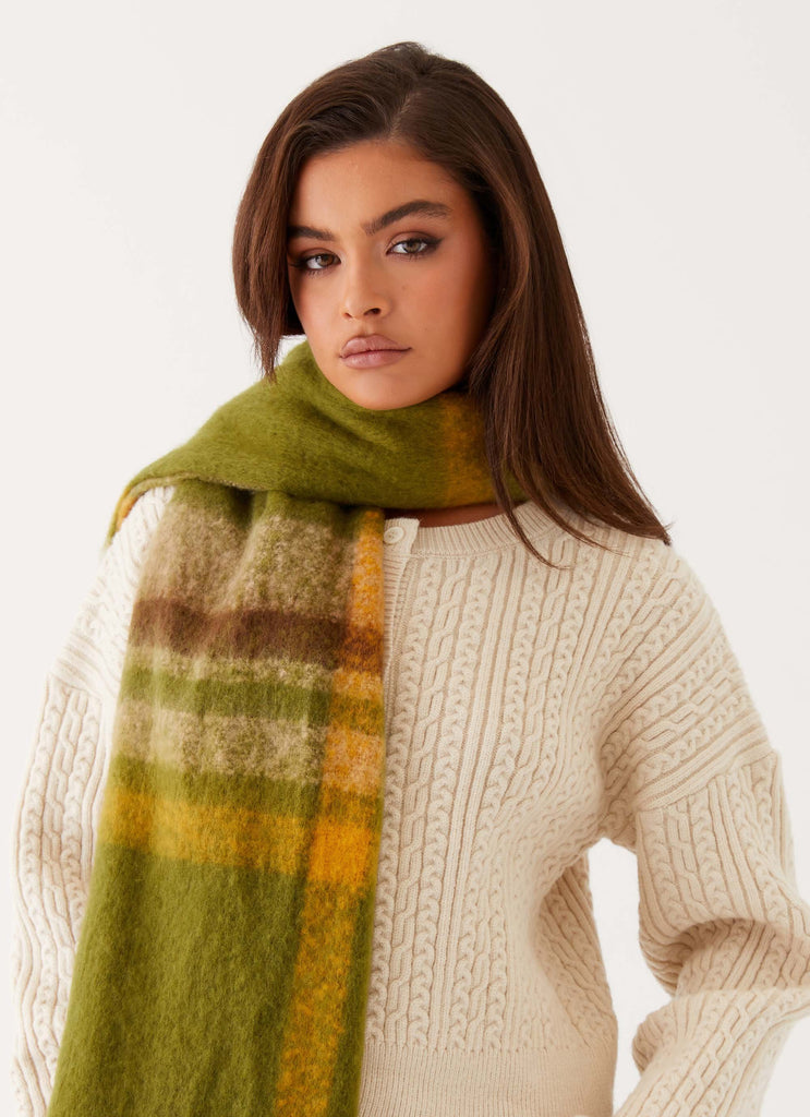 Womens Rainier Plaid Scarf in the colour Green in front of a light grey background