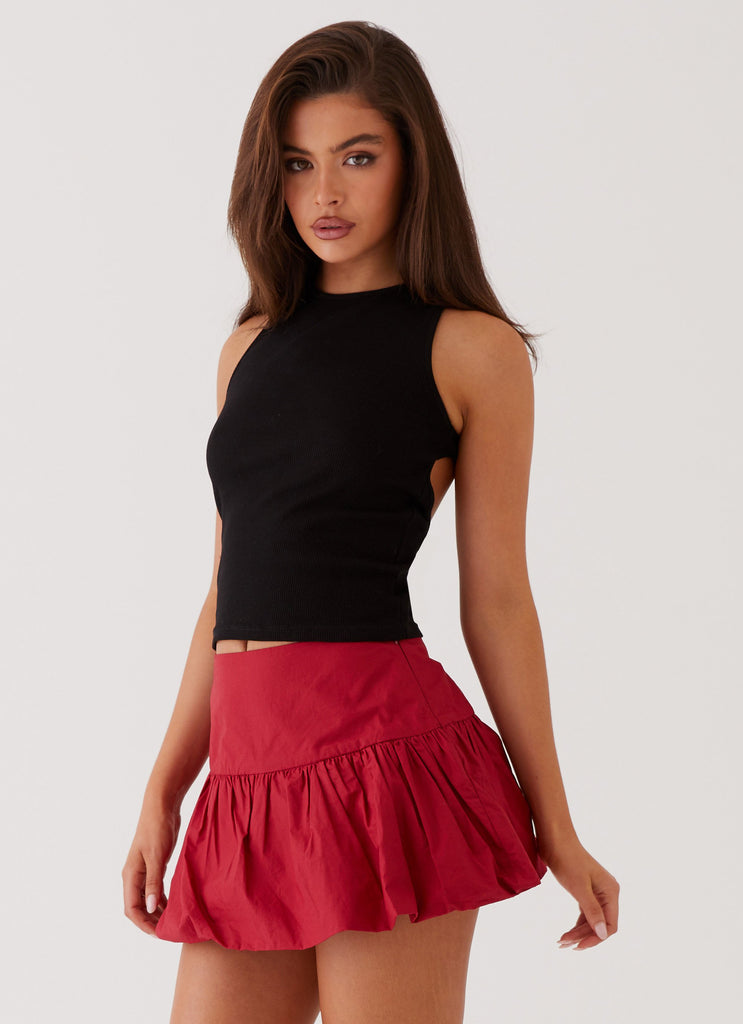 Womens Hotel California Low Rise Mini Skirt in the colour Red in front of a light grey background