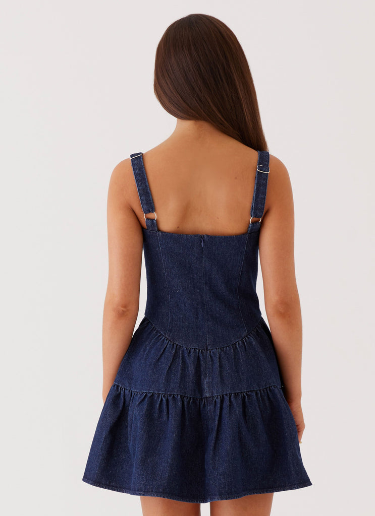 Womens Lucie Denim Mini Dress in the colour Indigo in front of a light grey background