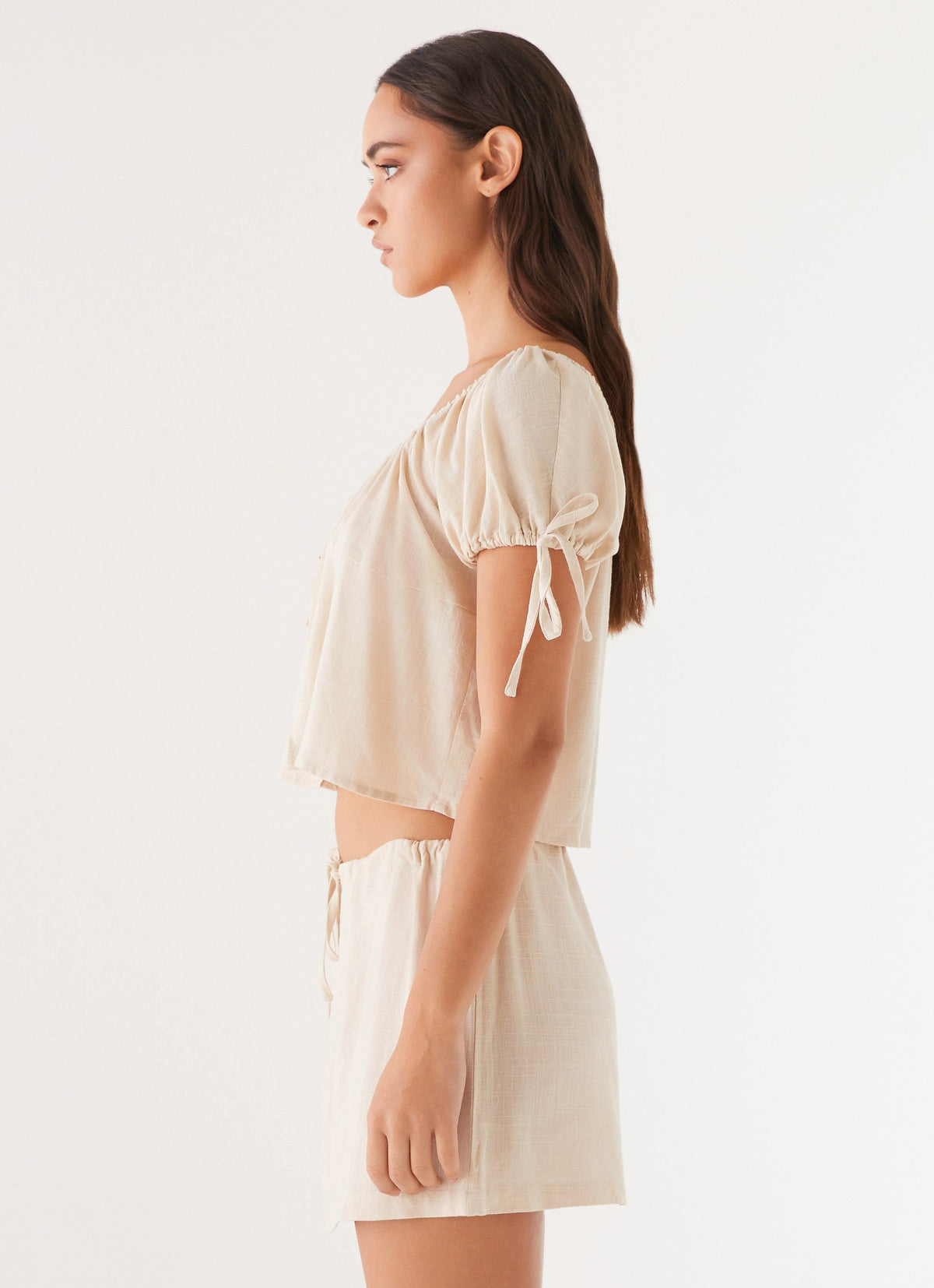 Womens Amber Fields Linen Mini Skirt in the colour Natural in front of a light grey background