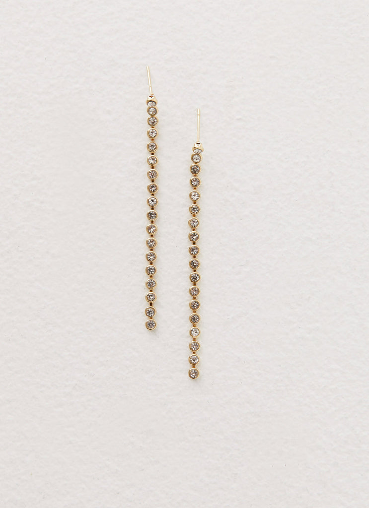 Womens Reina Earrings in the colour Gold in front of a light grey background