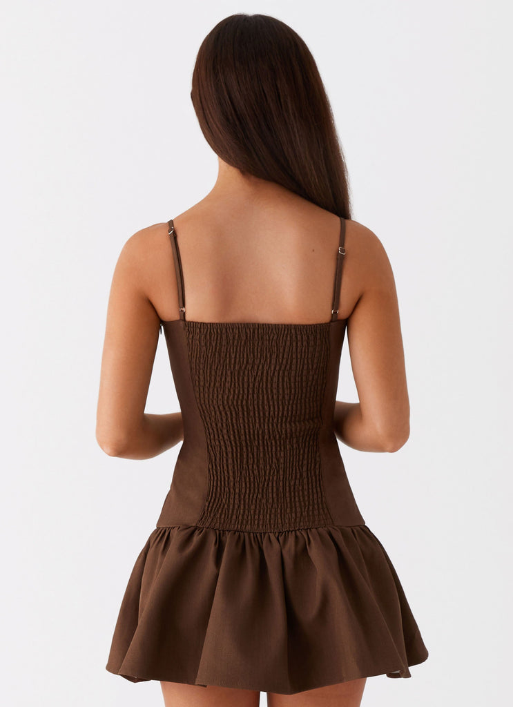 Womens Running Late Mini Dress in the colour Chocolate in front of a light grey background