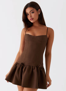 Womens Running Late Mini Dress in the colour Chocolate in front of a light grey background