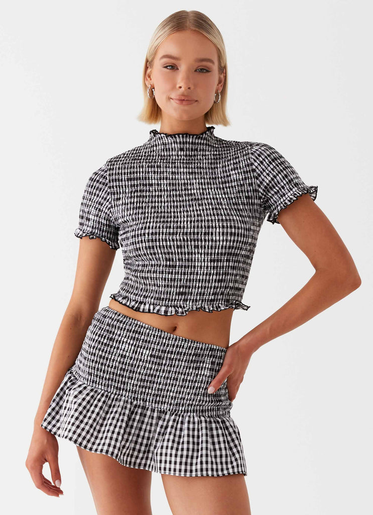 Womens Sweetest Pie Mini Skirt in the colour Black in front of a light grey background