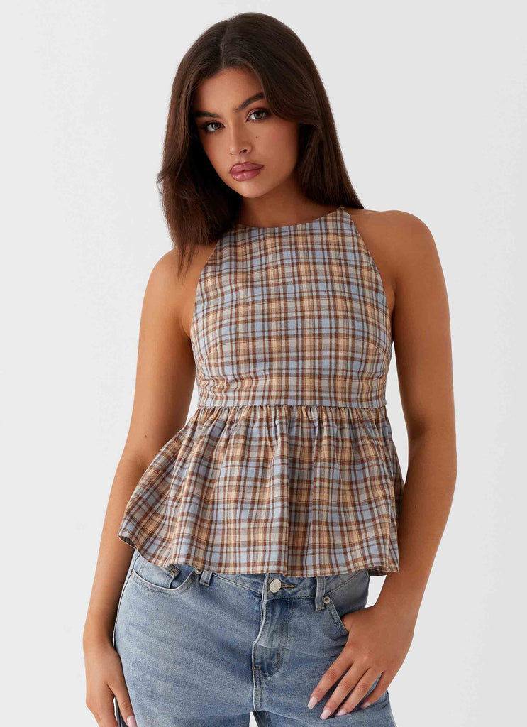 Womens Tanith Ruffle Top in the colour Brown Check in front of a light grey background