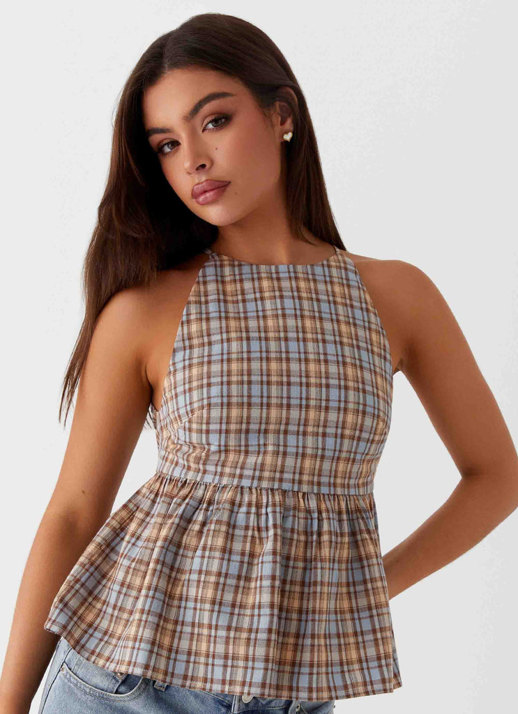 Womens Tanith Ruffle Top in the colour Brown Check in front of a light grey background