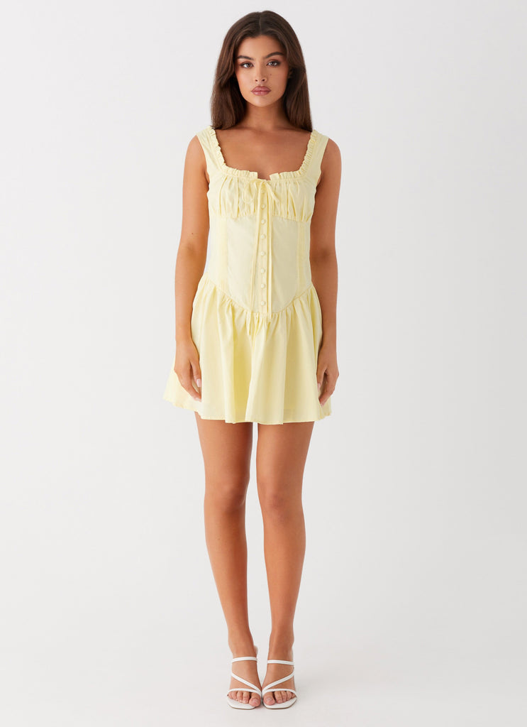 Womens Wren Mini Dress in the colour Yellow in front of a light grey background