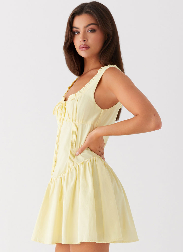 Womens Wren Mini Dress in the colour Yellow in front of a light grey background