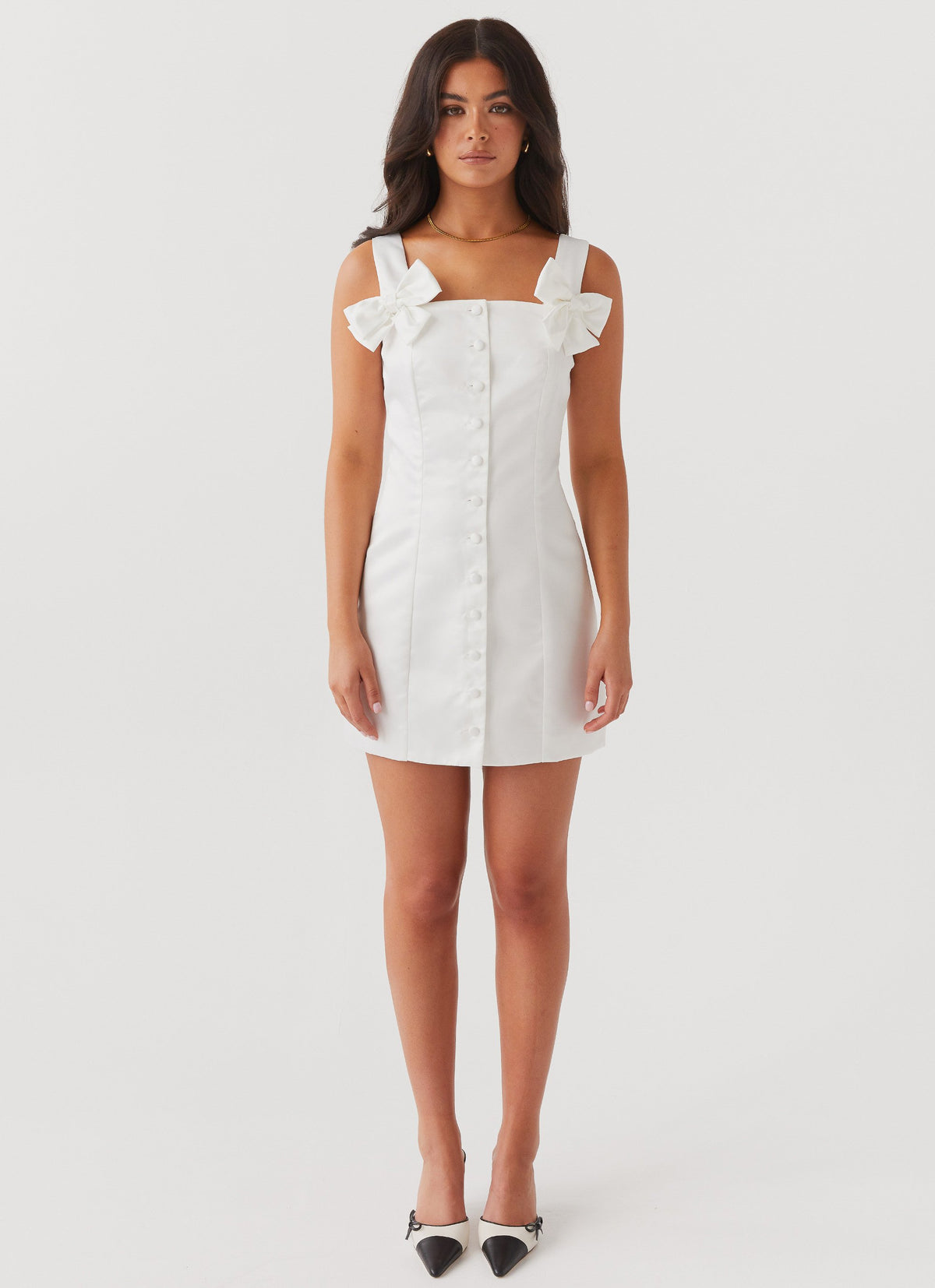 Womens Brielle Bow Satin Mini Dress in the colour White in front of a light grey background